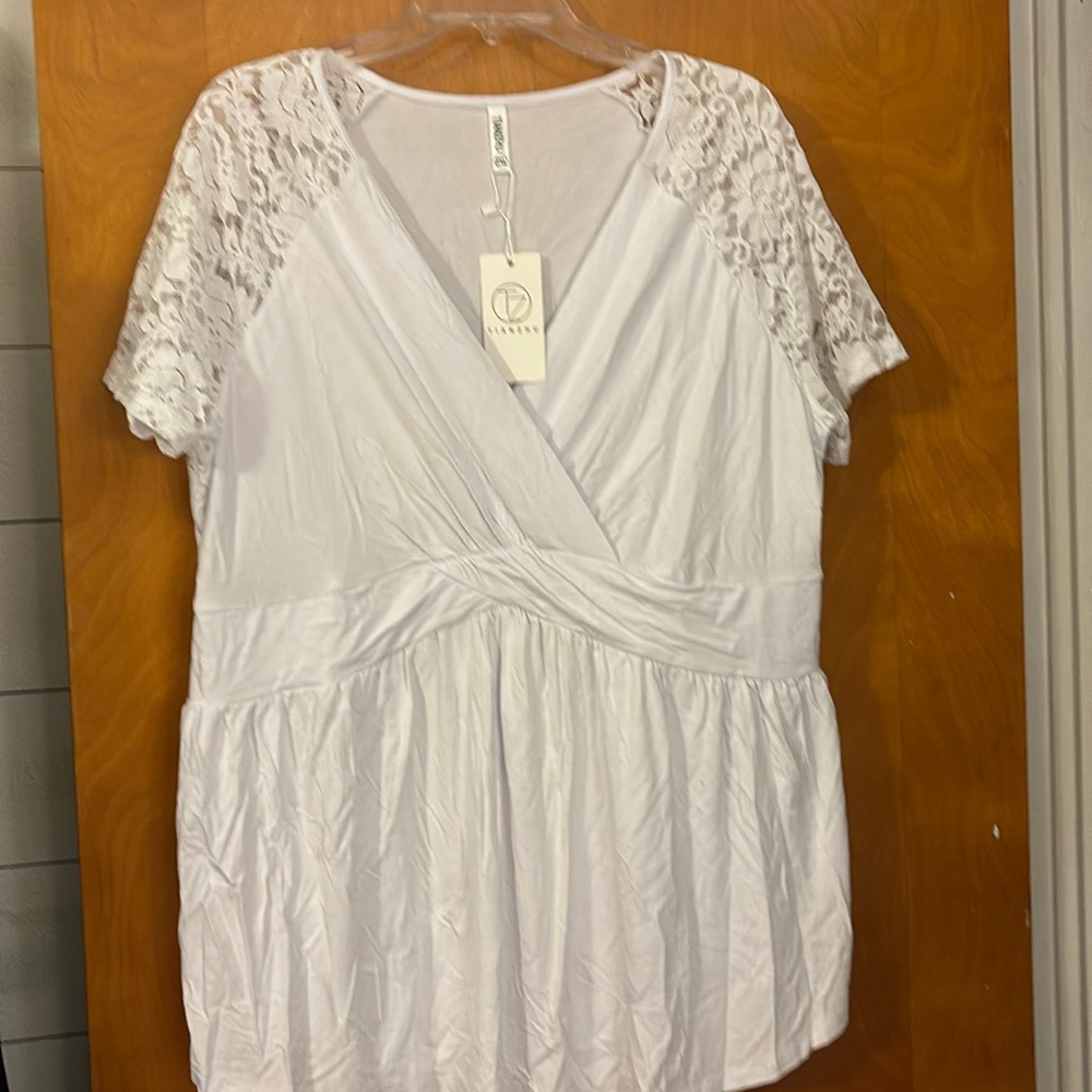 Lightweight lacy sleeve dressy top.